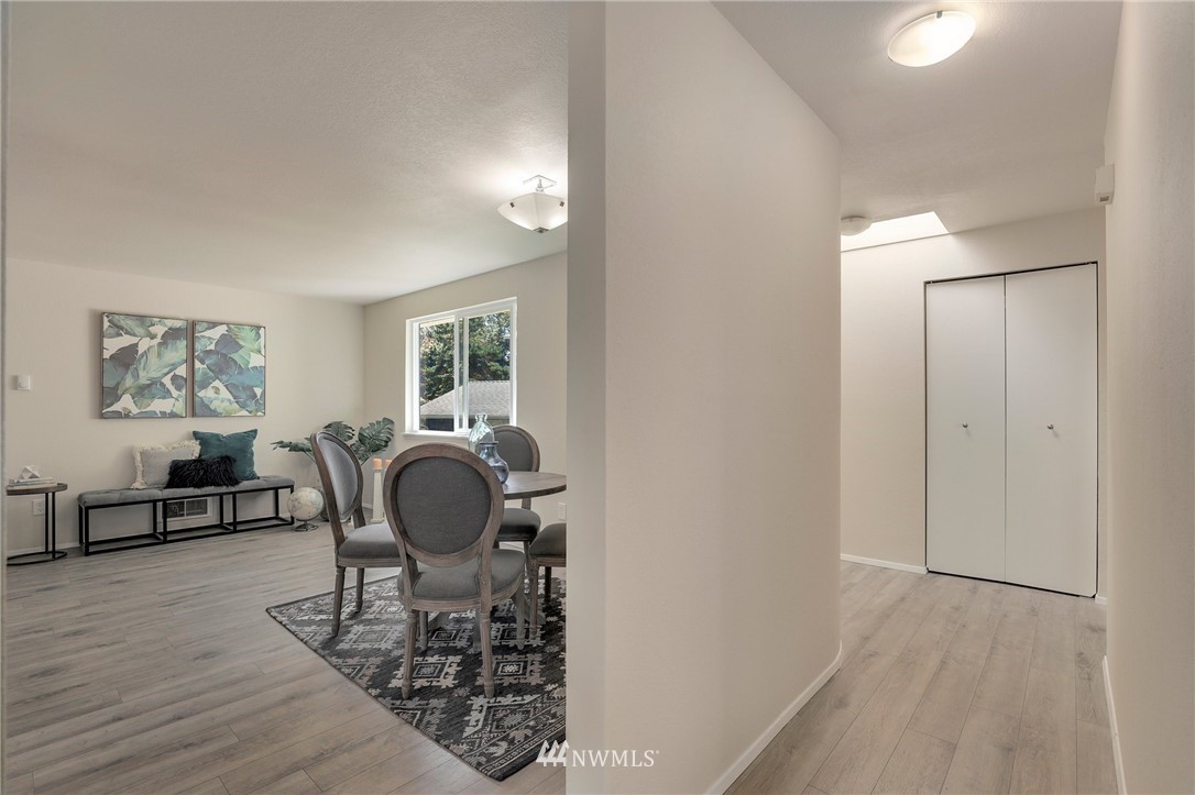 1017 234th Place Southwest Bothell, WA 98021 - Photo 8 of 28 a dining room with furniture and wooden floor