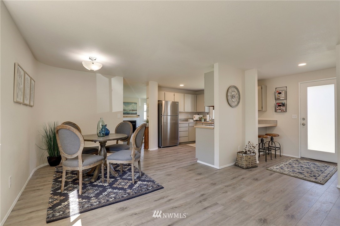 1017 234th Place Southwest Bothell, WA 98021 - Photo 10 of 28 a dining room with furniture and a window