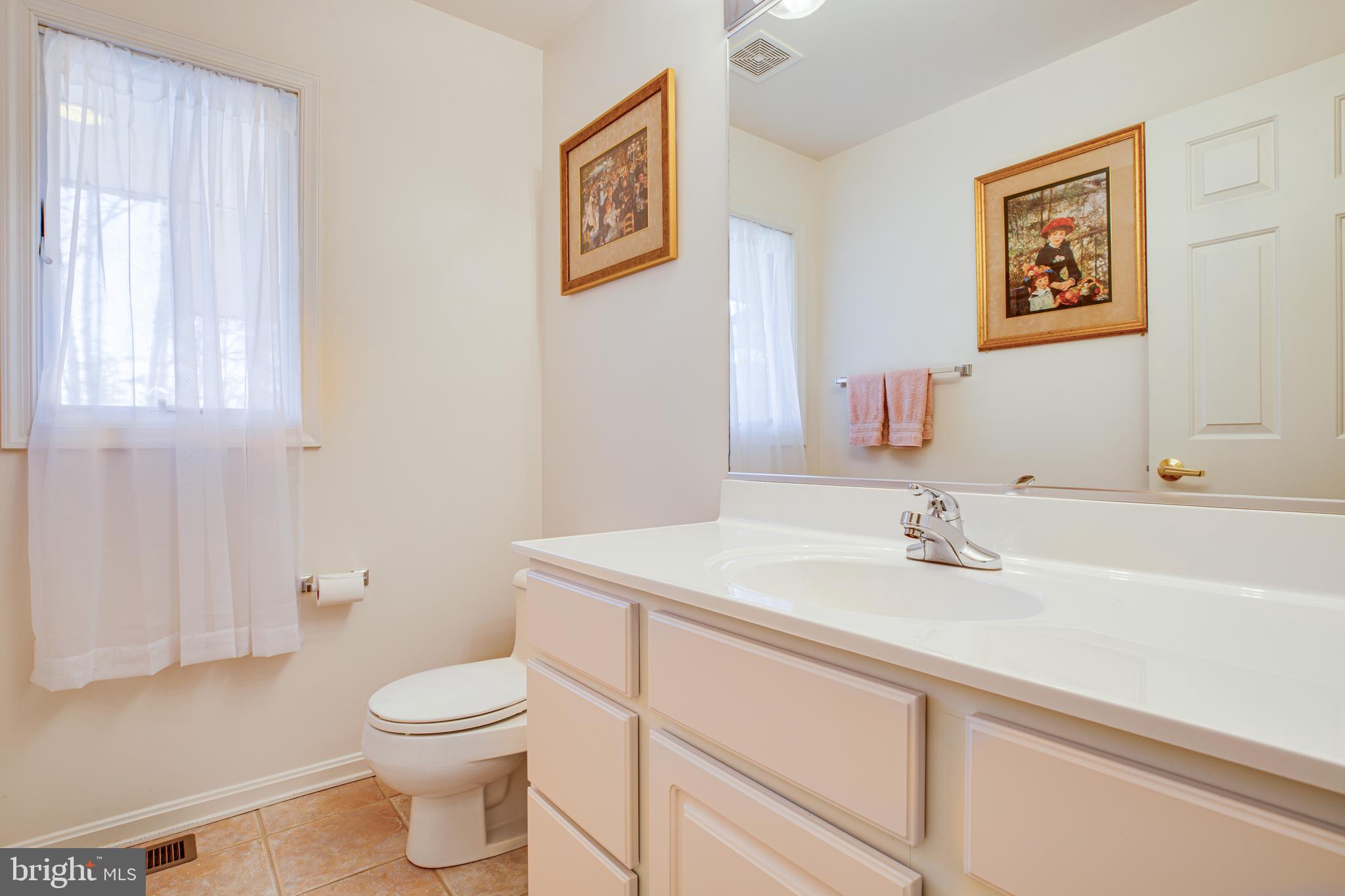 19 Winning Colors Road Stafford, VA 22556 - Photo 10 of 33 a bathroom with a toilet sink and mirror