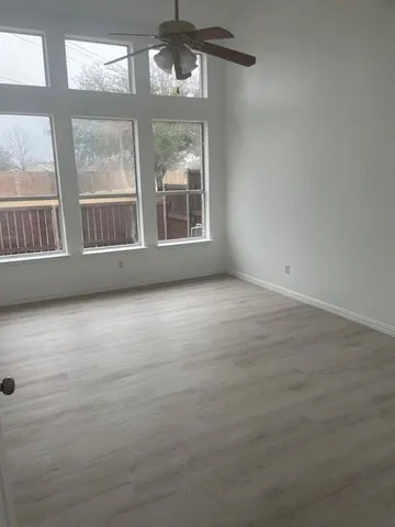 a view of an empty room with a window