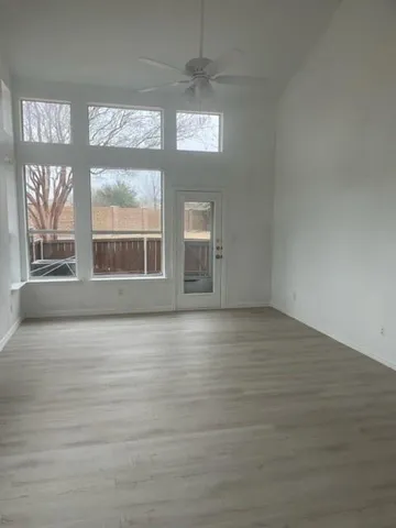 a view of an empty room with a window