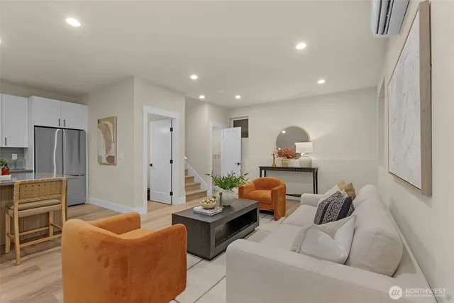 a view of a hallway with wooden floor and entryway