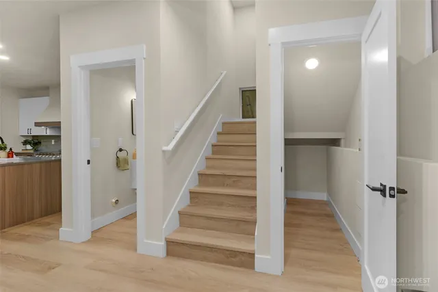 a spacious bedroom with a bed and a couch