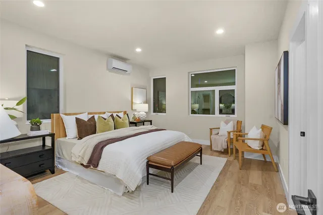 a bedroom with a bed and a couch