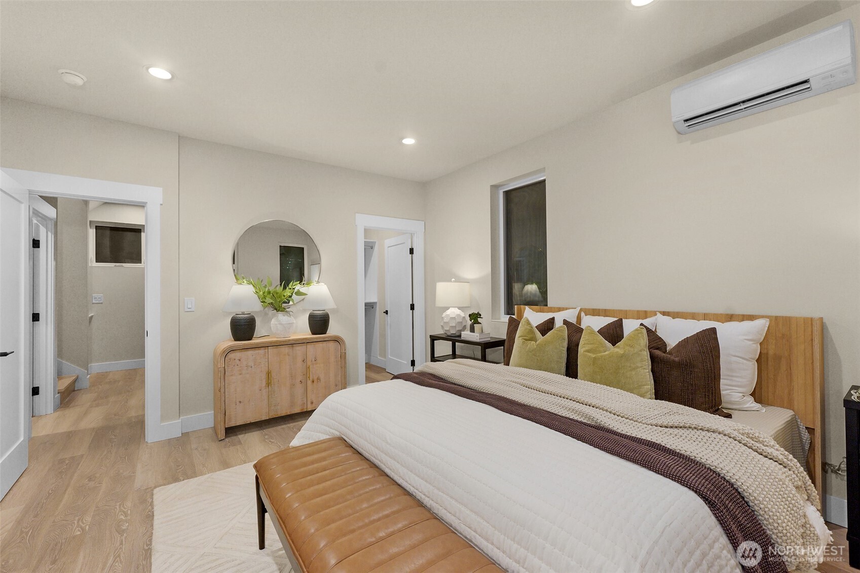 910 15th Avenue Seattle, WA 98122 - Photo 16 of 35 a spacious bedroom with a bed and a couch