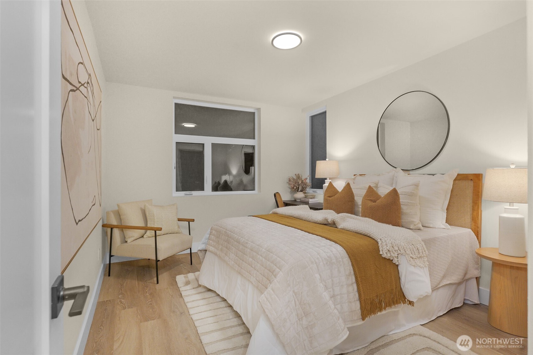 910 15th Avenue Seattle, WA 98122 - Photo 22 of 35 a bedroom with a bed and wooden floor