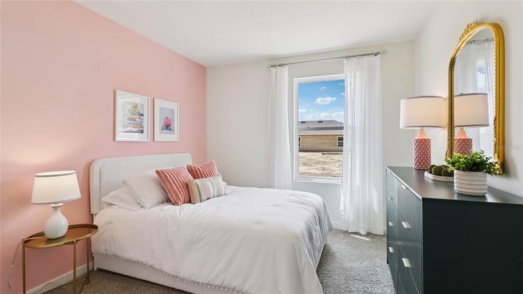 4694 Kona Circle Spring Hill, FL 34608 - Photo 20 of 29 a bedroom with a bed and a mirror
