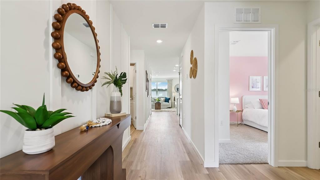 4694 Kona Circle Spring Hill, FL 34608 - Photo 2 of 29 a view of a hallway with dining room and stairs