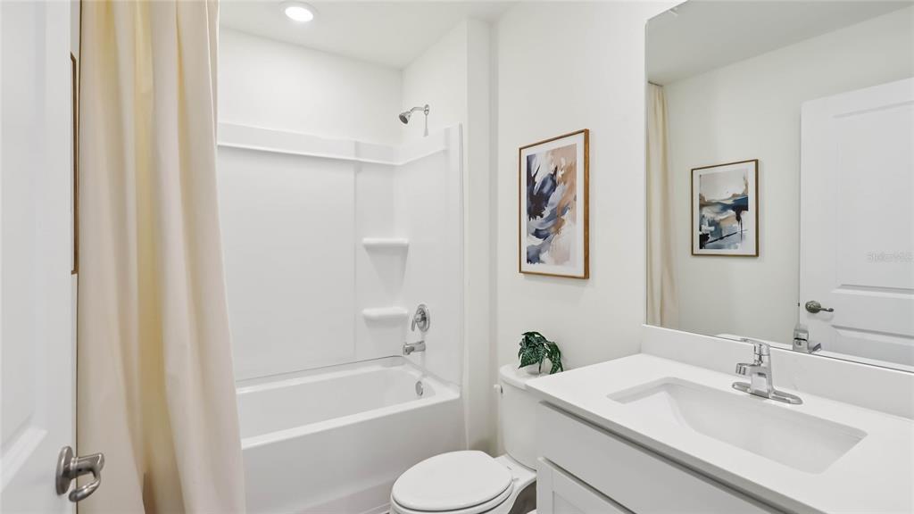 4694 Kona Circle Spring Hill, FL 34608 - Photo 21 of 29 a bathroom with a sink toilet and bathtub