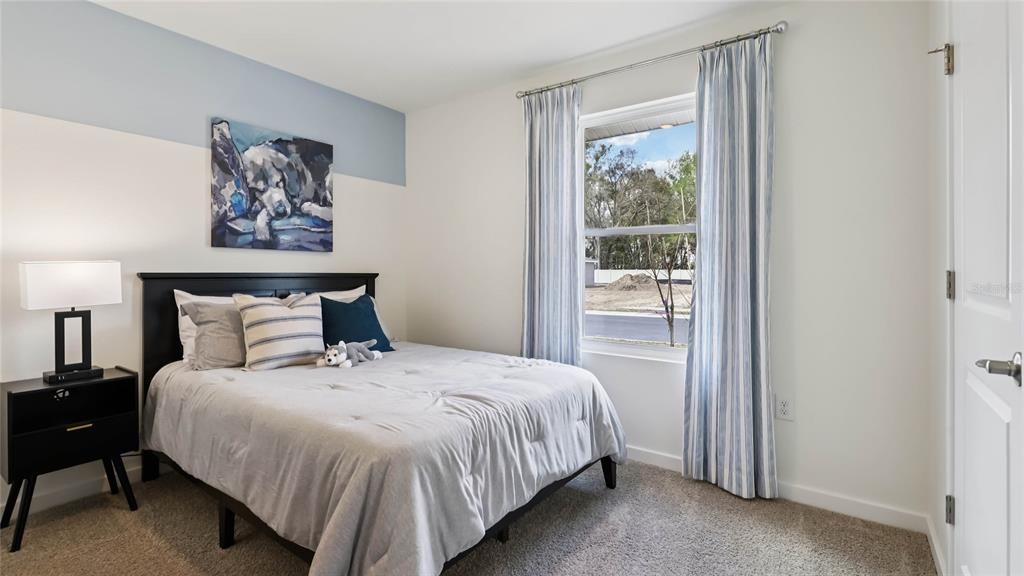 4694 Kona Circle Spring Hill, FL 34608 - Photo 22 of 29 a bedroom with a bed and a window
