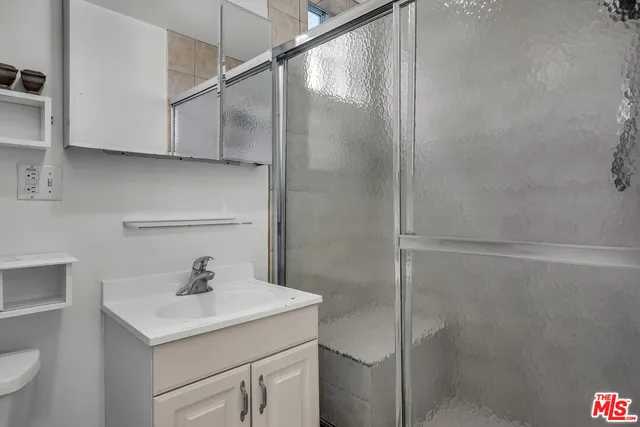 a bathroom with a sink and mirror