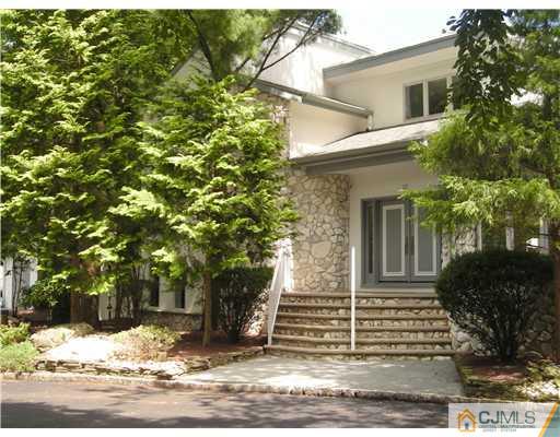 a view of a house with a tree