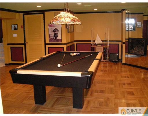 22 Evan Drive Morganville, NJ 07751 - Photo 14 of 14 a room with pool table and windows