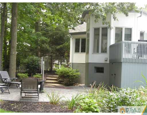 22 Evan Drive Morganville, NJ 07751 - Photo 3 of 14 a view of a house with backyard and sitting area