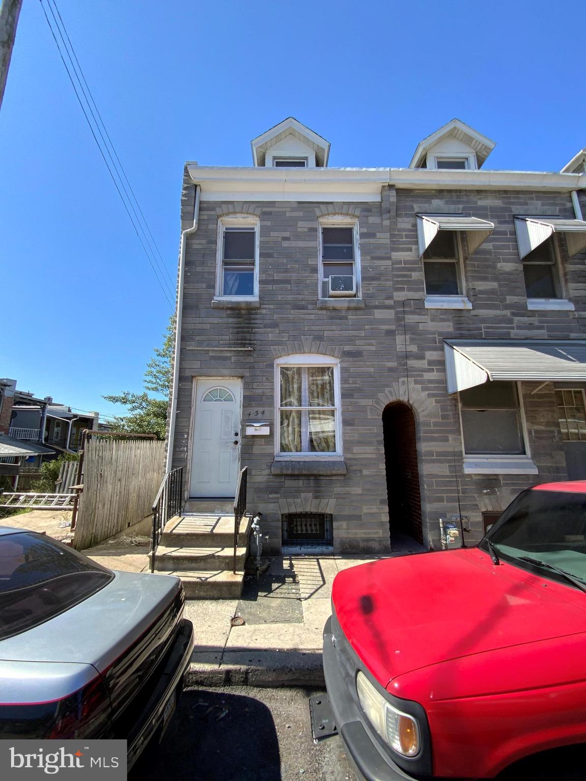 a front view of a house with swimming pool