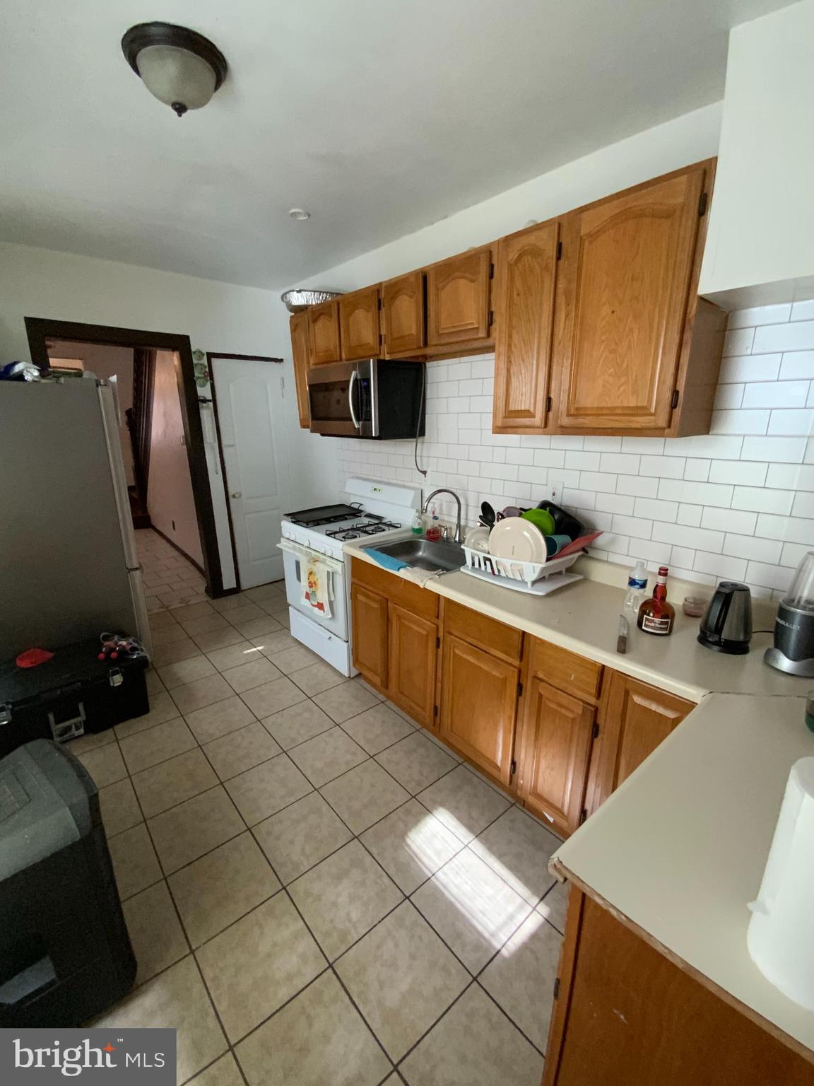 434 Birch Street Reading, PA 19604 - Photo 4 of 12 a kitchen that has a sink and a stove in it