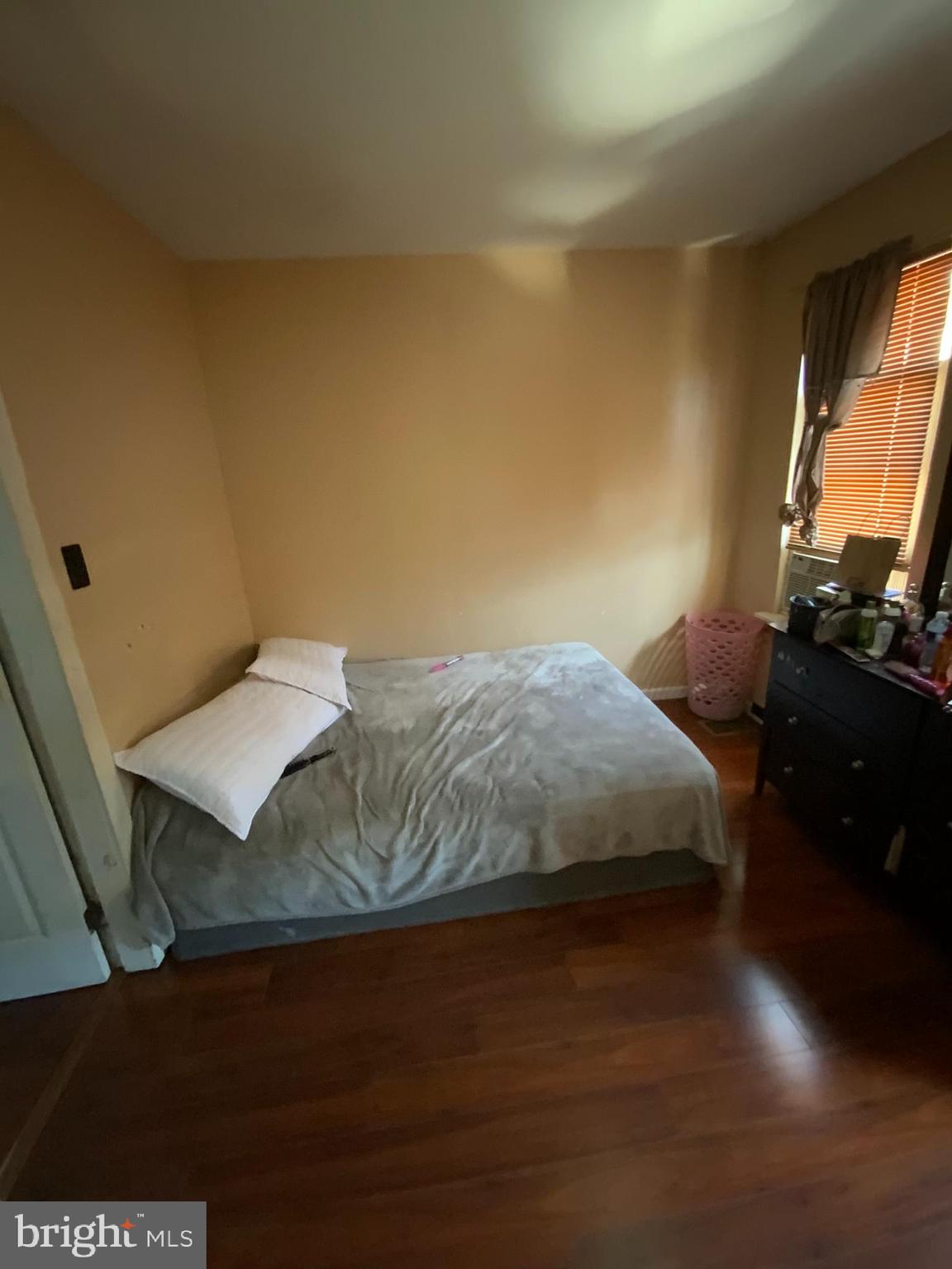 434 Birch Street Reading, PA 19604 - Photo 5 of 12 a bedroom with a bed and a flat tv screen on dresser