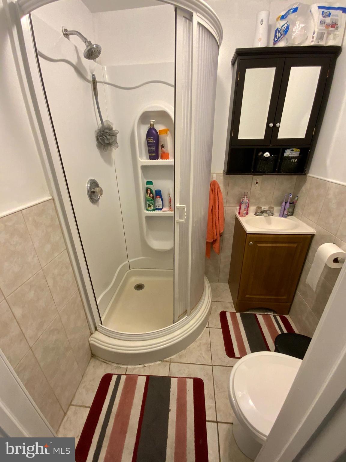 434 Birch Street Reading, PA 19604 - Photo 9 of 12 a bathroom with a sink toilet and mirror