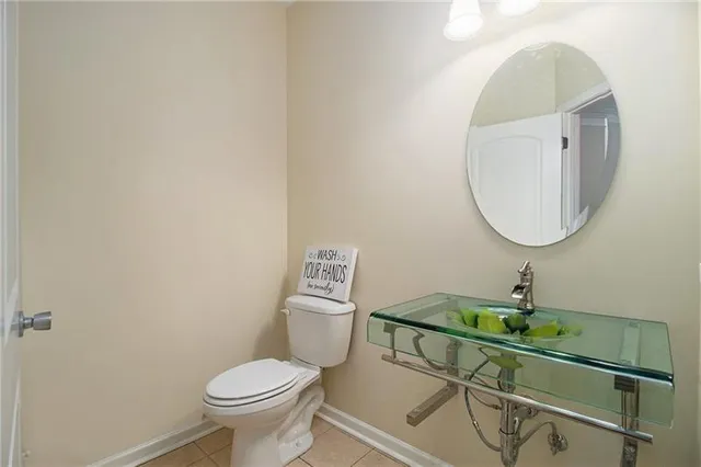 a view of a livingroom with a ceiling fan and window
