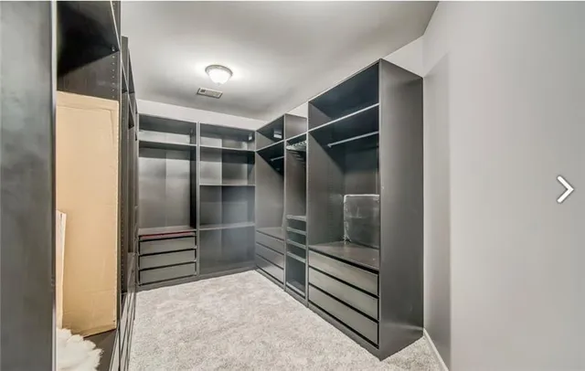 a living room with a piano and a window