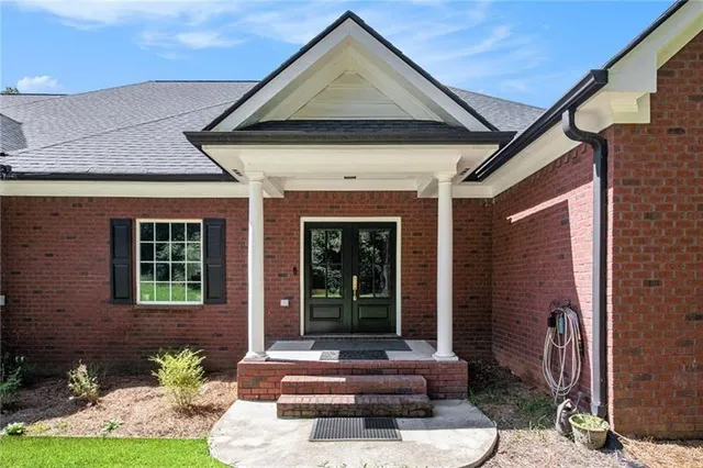 a front view of a house with garden