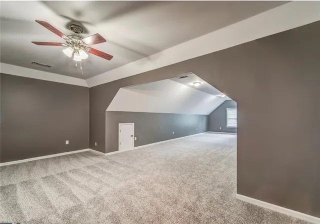 a view of a room with wooden walls