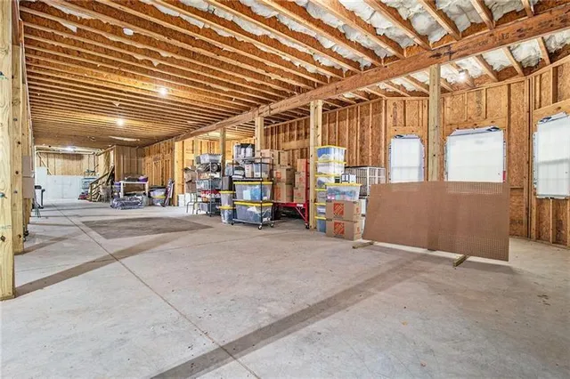 a front view of a house with barbeque and wooden floor