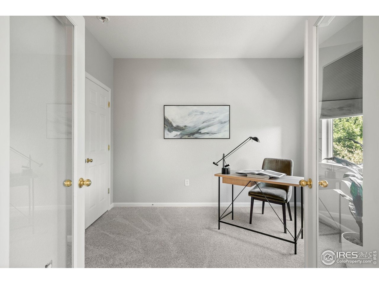 4501 Nelson Road, Unit 2105 Longmont, CO 80503 - Photo 17 of 37 French doors of 3rd bedroom/office open to living room