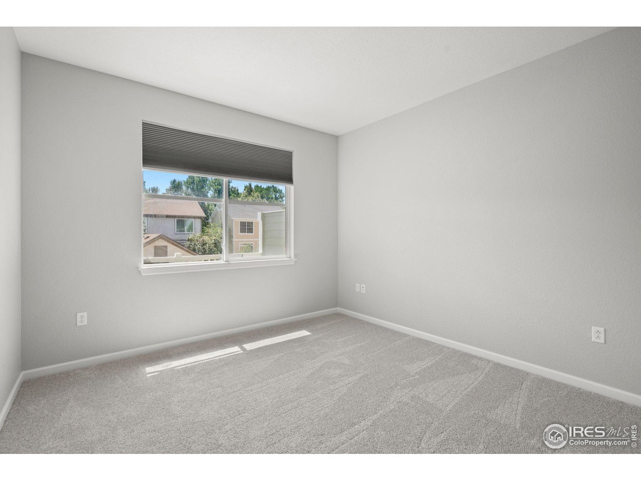 4501 Nelson Road, Unit 2105 Longmont, CO 80503 - Photo 23 of 37 2nd Bedroom with southern exposure