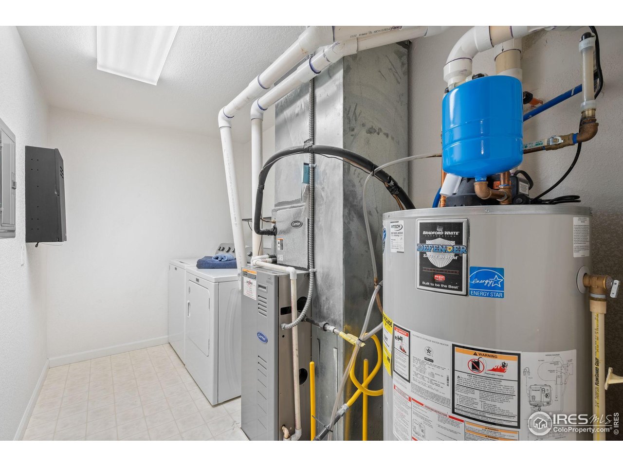 4501 Nelson Road, Unit 2105 Longmont, CO 80503 - Photo 27 of 37 Extra spacious utility/laundry room. Water heater, Maytag washer & dryer new in '21
