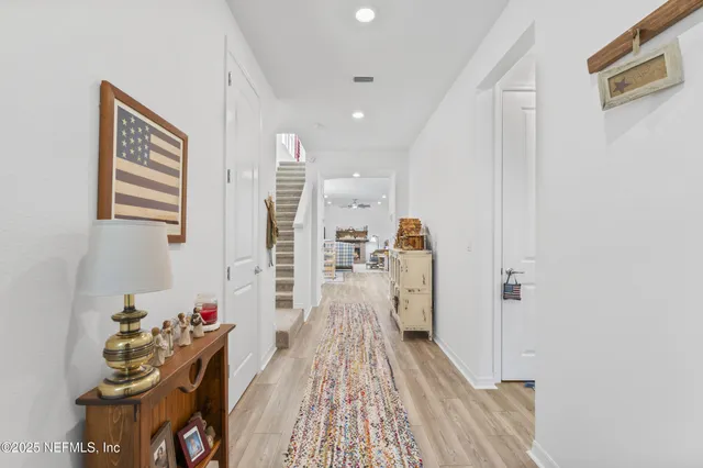 a living room filled with furniture and a potted plant