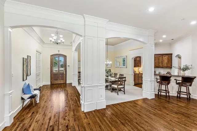 a view of livingroom with furniture wooden floor and windows