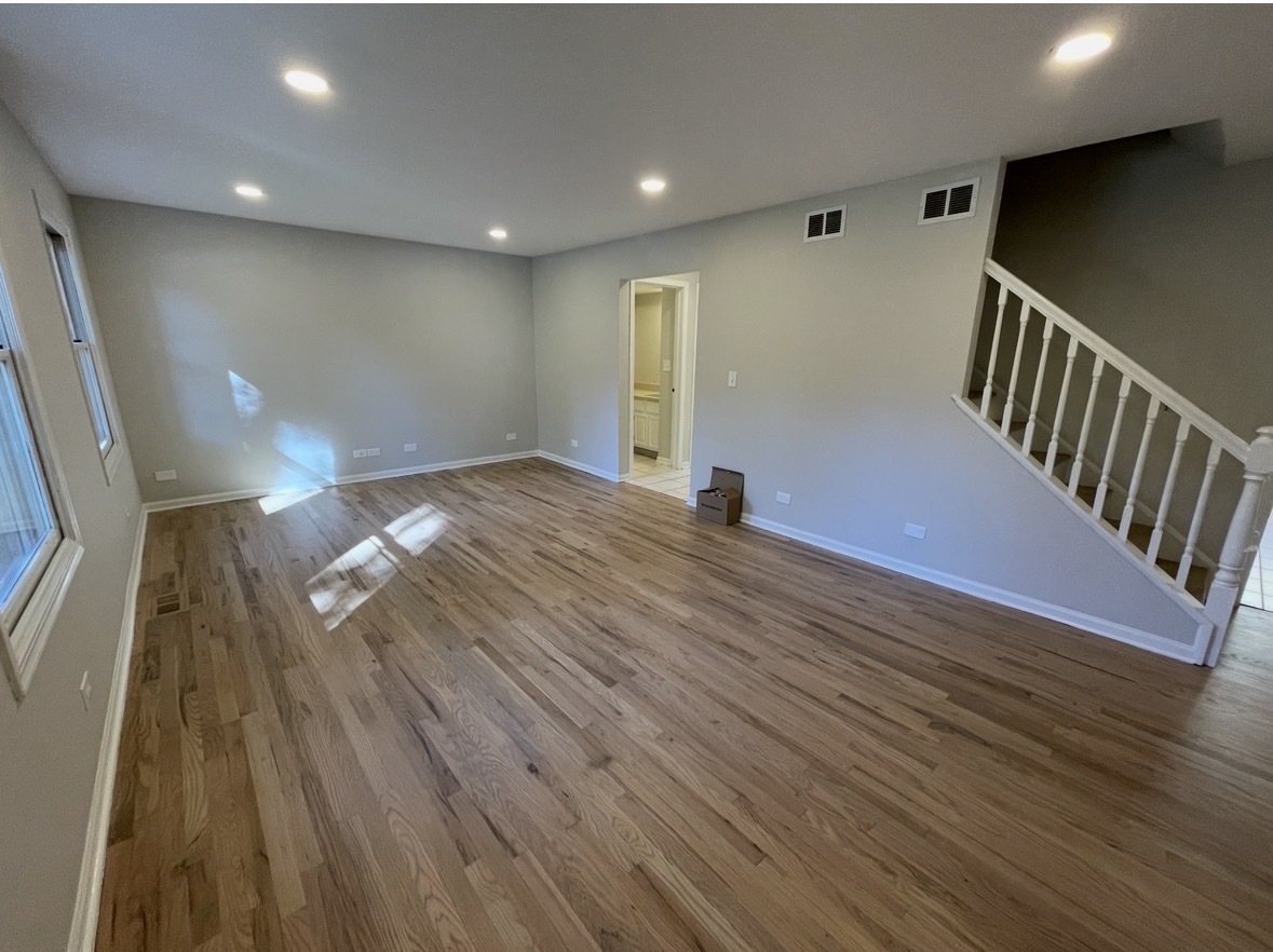 1703 Winnetka Road Northfield, IL 60093 - Photo 3 of 10 a view of empty room with wooden floor