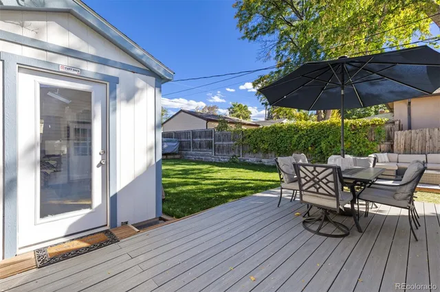 a view of a chair and table on the wooden floor
