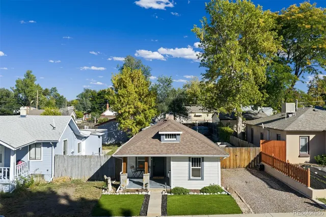 a aerial view of a house with a yard