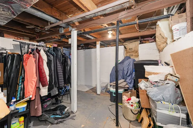a view of walk in closet with clothes