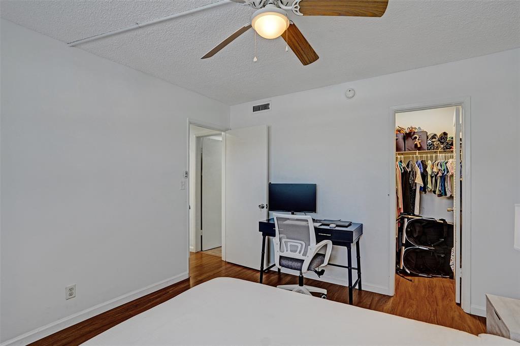 2350 Northeast 14th Street Causeway, Unit 203 Pompano Beach, FL 33062 - Photo 15 of 23 a view of a workspace with furniture and a window