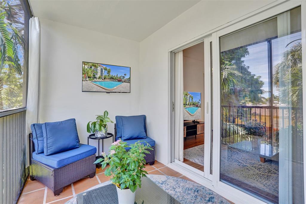 2350 Northeast 14th Street Causeway, Unit 203 Pompano Beach, FL 33062 - Photo 17 of 23 a view of living room filled with furniture