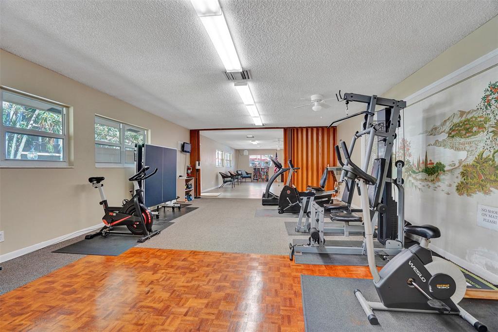 2350 Northeast 14th Street Causeway, Unit 203 Pompano Beach, FL 33062 - Photo 20 of 23 a view of a room with gym equipment