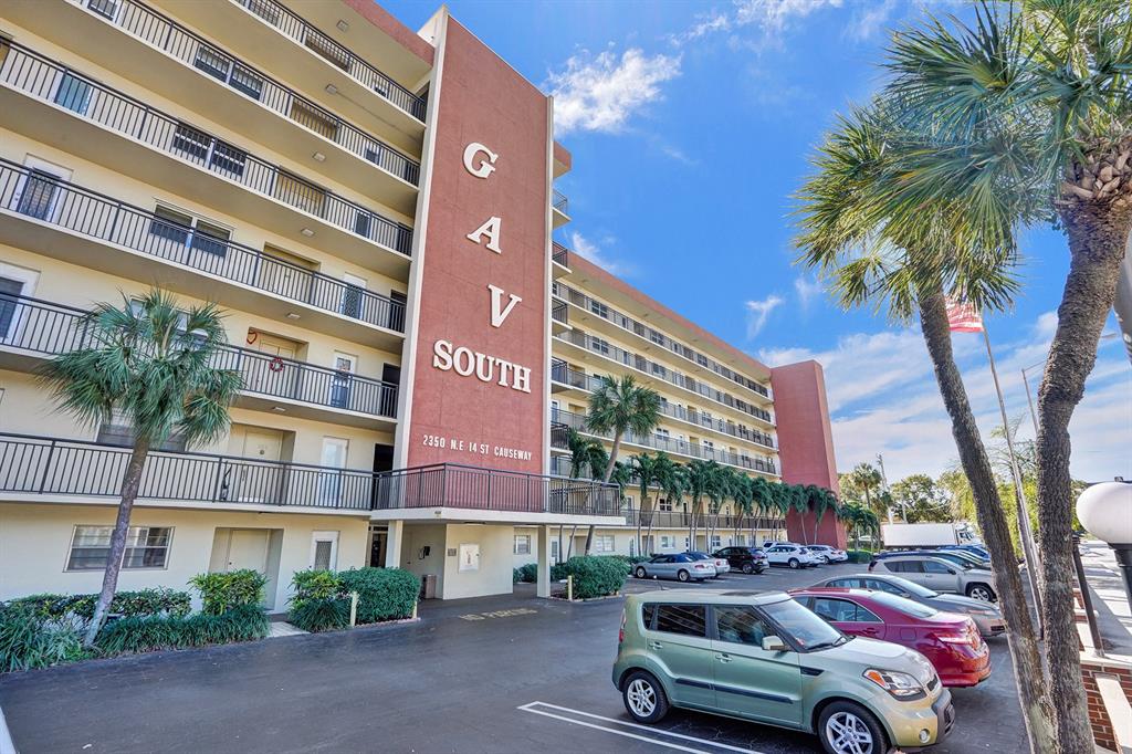 2350 Northeast 14th Street Causeway, Unit 203 Pompano Beach, FL 33062 - Photo 23 of 23 a car parked in front of a building