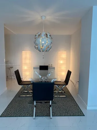 a living room with furniture rug and window