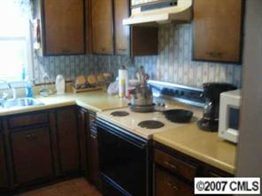 3965 Marshall Road Rock Hill, SC 29730 - Photo 2 of 4 a kitchen with a sink a stove and cabinets
