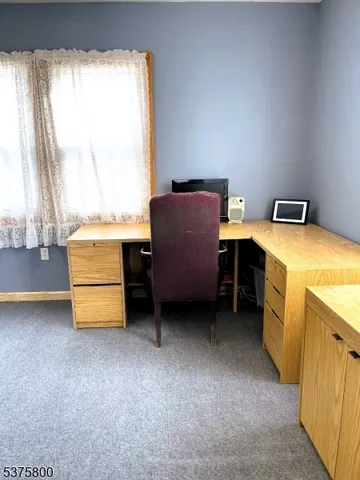 a room with a desk and a window