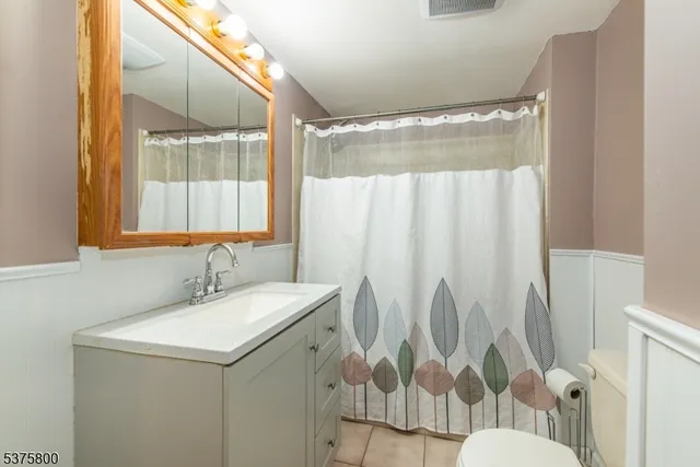 a bathroom with a sink and mirror