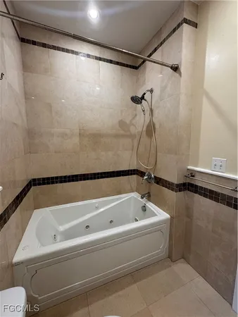 a bathroom with a shower and a bathtub