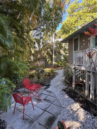 a view of a backyard with sitting area
