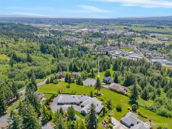 an aerial view of a house with a garden