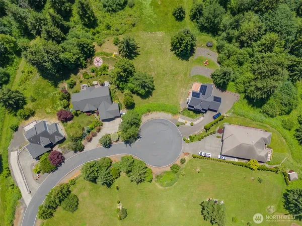 an aerial view of a house with yard swimming pool and outdoor seating