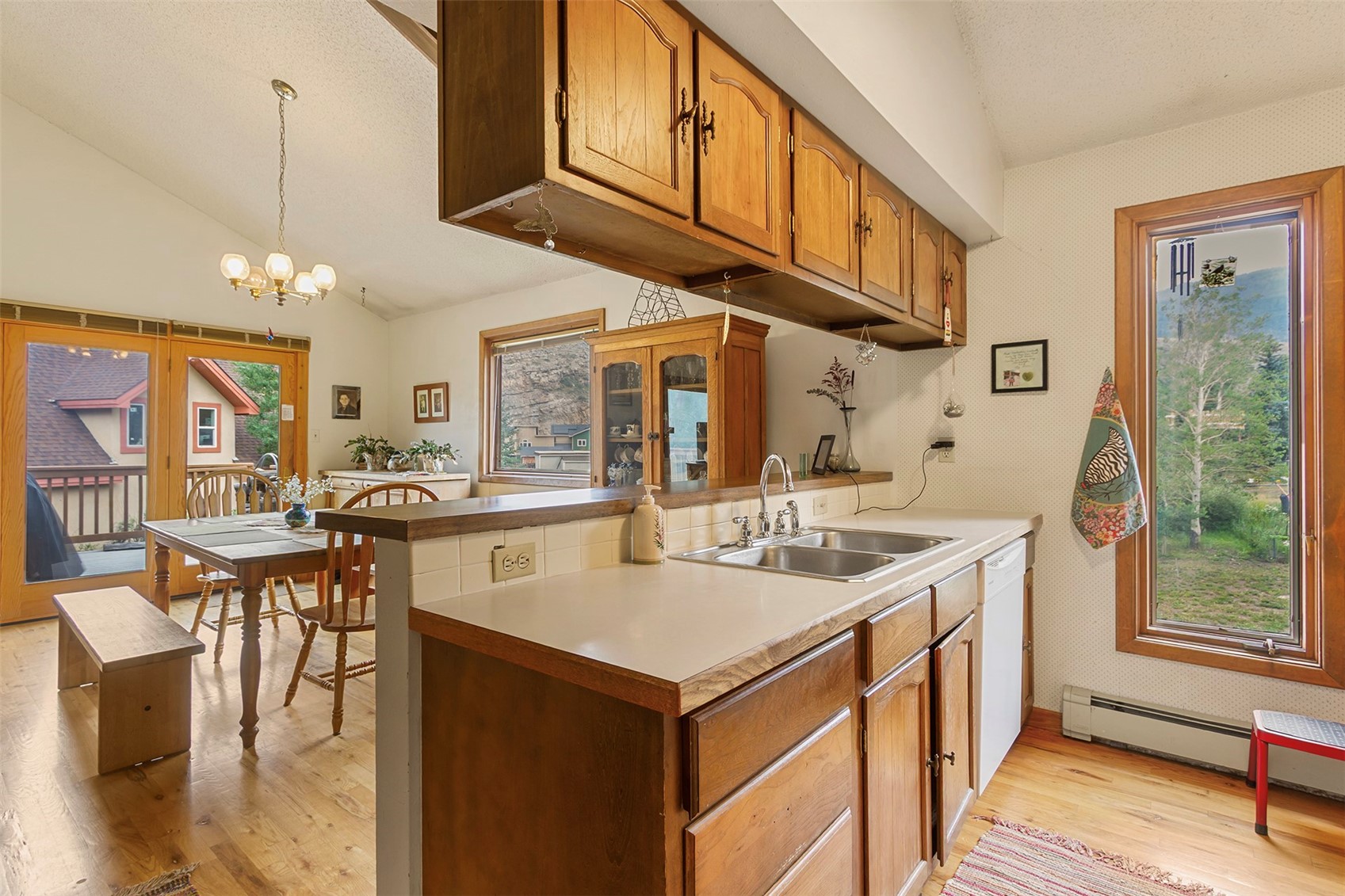 857 Deer Path Road Dillon, CO 80435 - Photo 11 of 29 a kitchen with a sink a stove and chairs