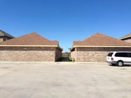 a view of a car parked in front of a house